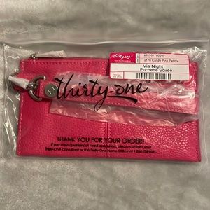 NWT Via Night wristlet in candy pink with wristlet strap.